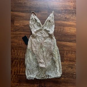 Stunning nude dress with gold sparkle details.